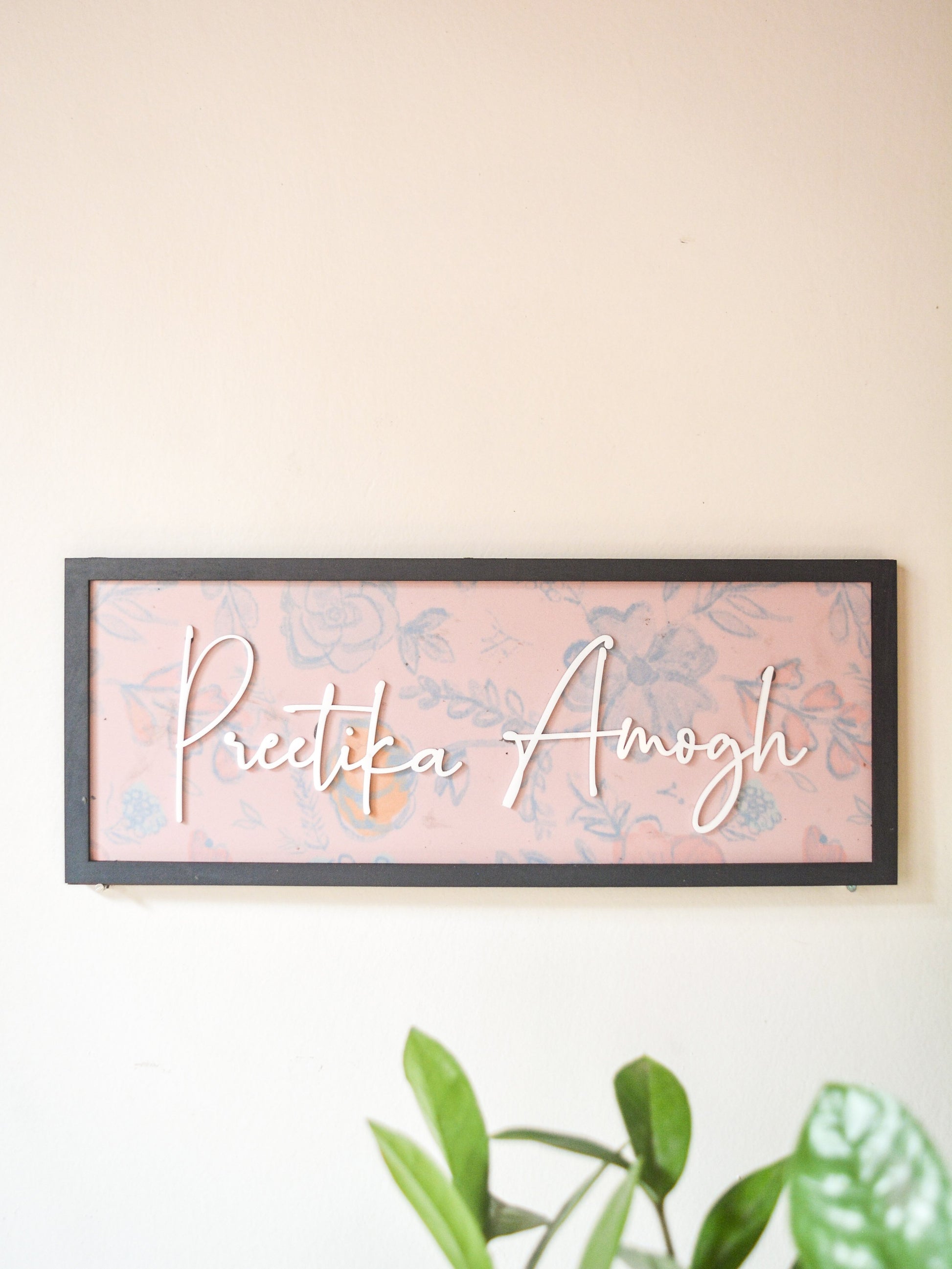 framed couple pink nameplate